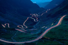 Light trails on the highest mountain road in Romania, Fagaras mountains Poster 50x70 cm
