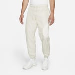 Pantalon doublé en tissu tissé Nike Sportswear Swoosh pour Homme - Gris