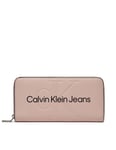 Calvin Klein Plånbok sculpted zip around pale Conch CK -