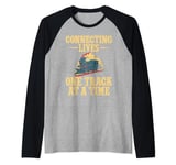 Connecting Lives one Track at a Time Train Conductor Raglan Baseball Tee