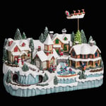 FEERIC CHRISTMAS - Village de Noël Lumineux et animé avec Train Enfants sur patinoire et Père Noël sur Son traîneau