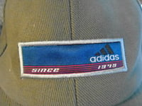 NEW ADIDAS  PEAK CAPS-PACK OF TWO - ONE SIZE FITS ALL-1 NAVY BLUE, 1 ARMY GREEN